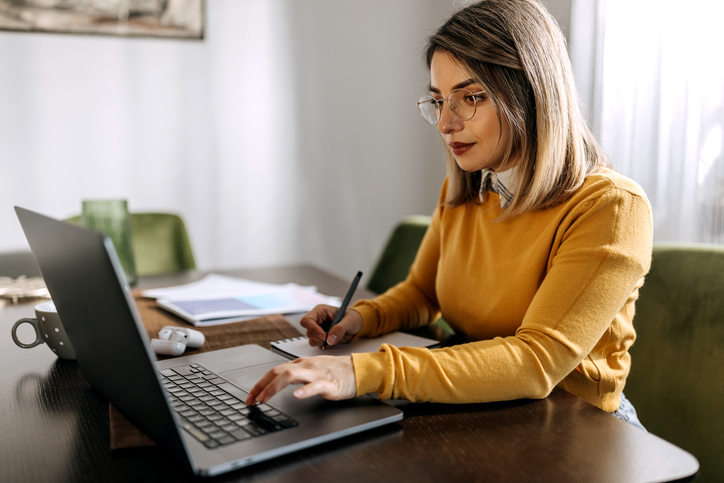 A woman researching when tenancy by the entirety can be canceled.