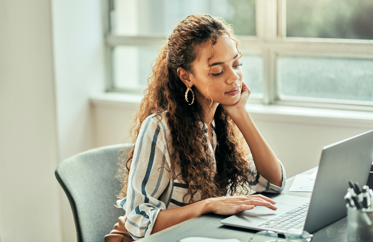 An investor comparing the pros and cons of using a bear call spread strategy.