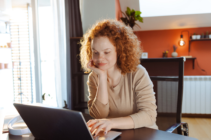 A woman researching how to fund a trust with personal property.