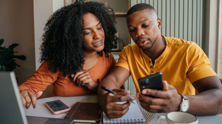 A couple looks over their finances together.
