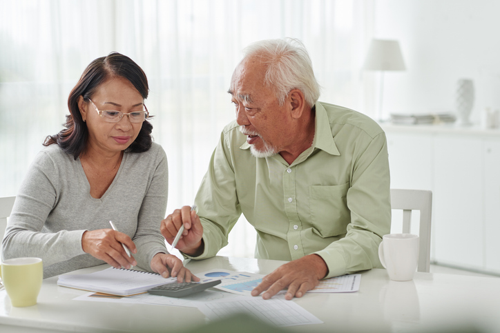 A couple creating a living trust to avoid probate for their beneficiaries.