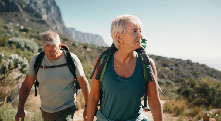 A couple enjoys a hike together.