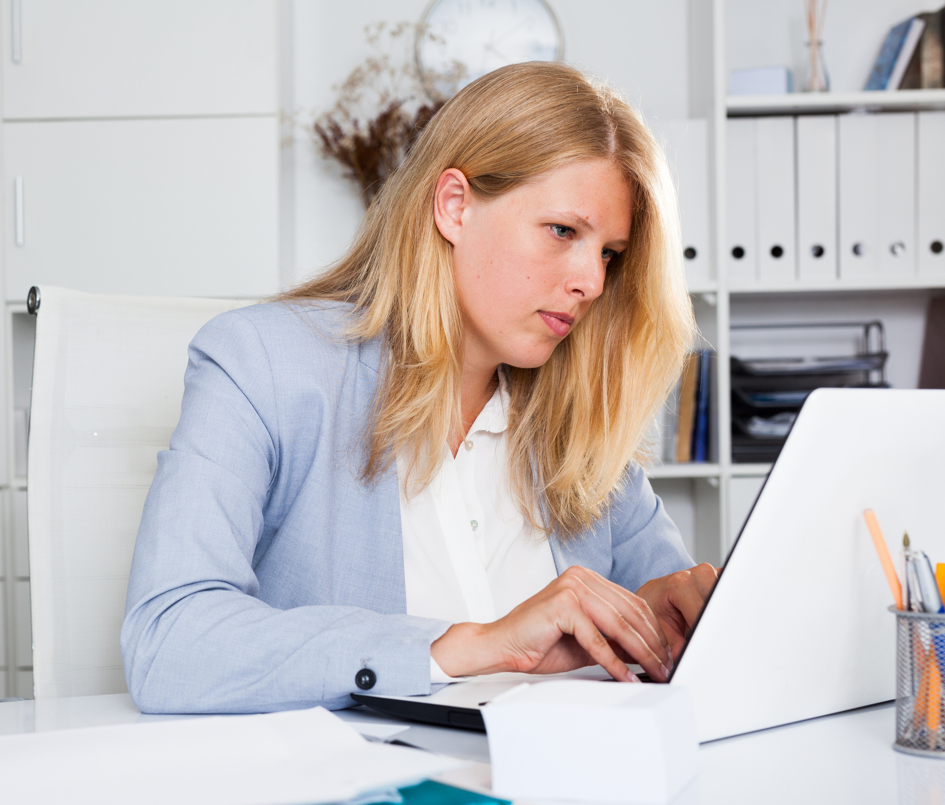 A woman looking up how a fee simple defeasible estate works in real estate.
