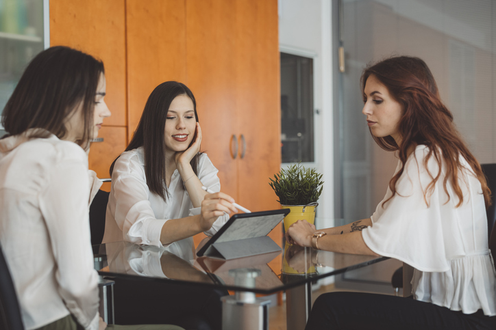 A financial advisor explaining different types of stop loss orders to clients.