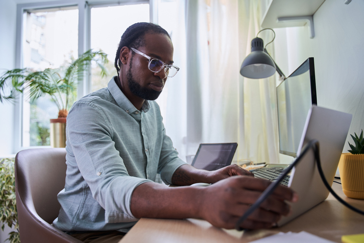 A man comparing property taxes in Texas and California.