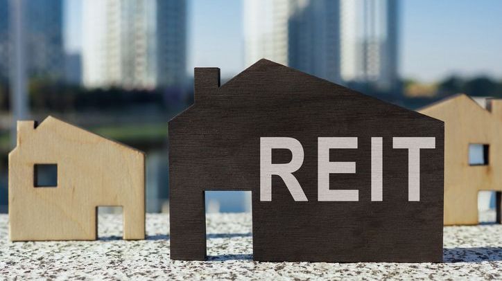 House models, including one with the letters "REIT," for real estate investment trust.