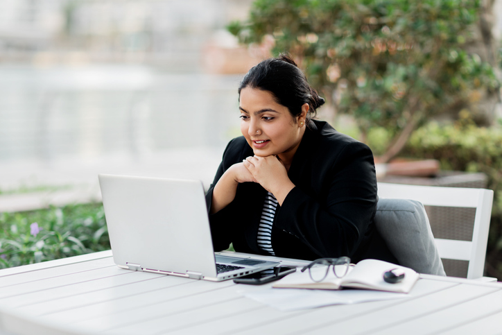 A woman creating a plan for early retirement.