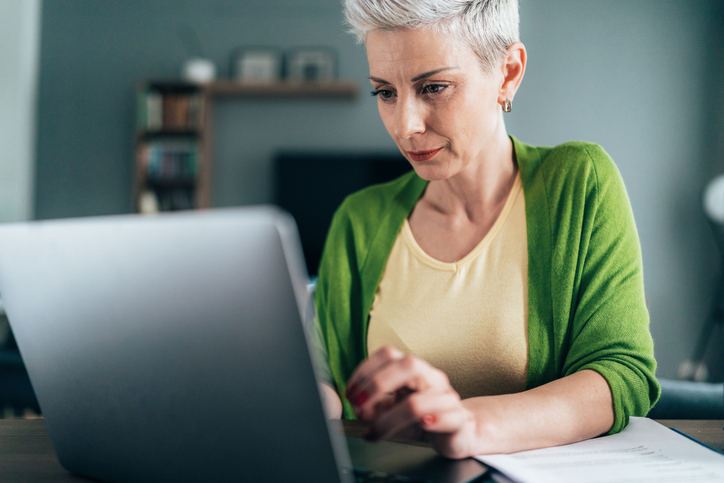 A woman looking up how partnerships are taxed.