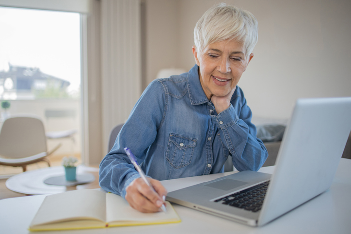 A real estate investor reviews her investment portfolio.
