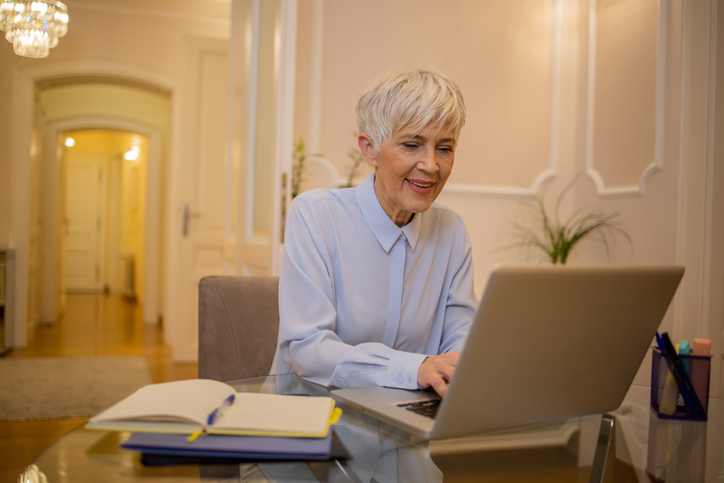 A woman deciding about claiming Social Security benefits at age 70.