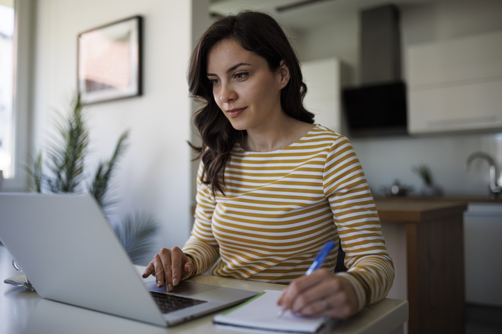 A woman preparing her taxes online.