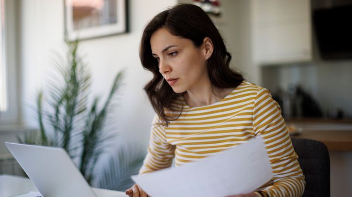 A serious young woman working at home.