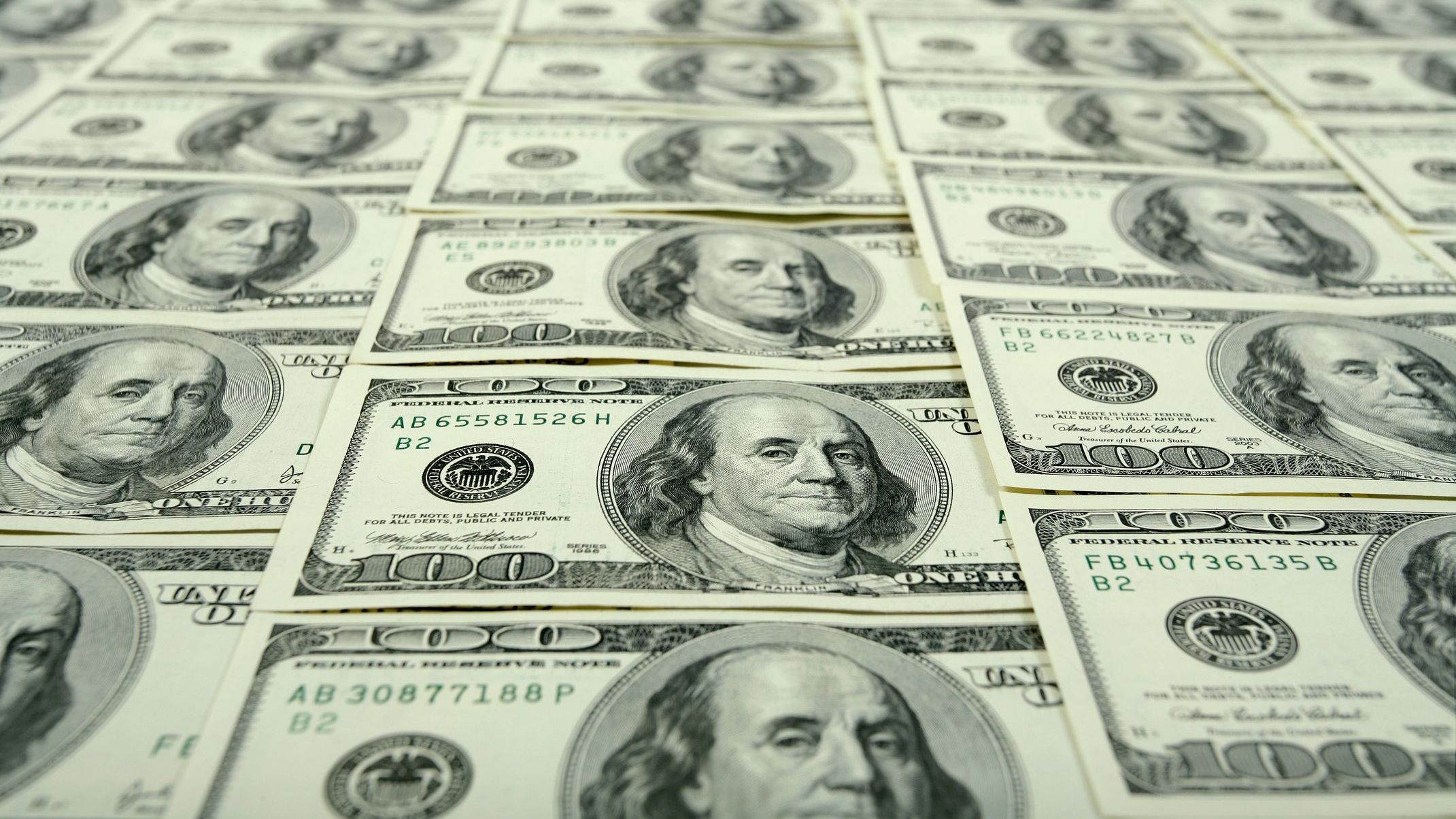 Dozens of $100 banknotes.