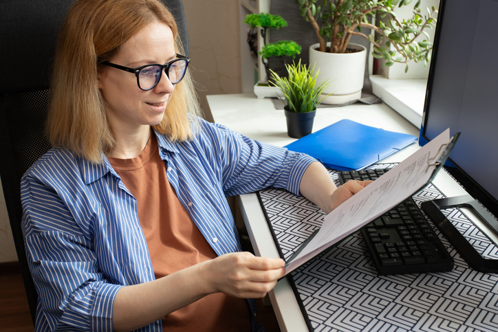 A homeowner reviewing documents for a rental to make sure that everything complies with requirements for the Augusta rule.