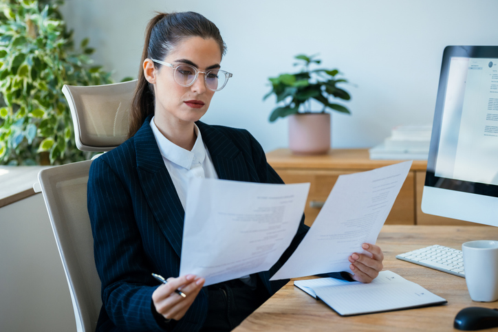An advisor reviewing financial documents for a client.