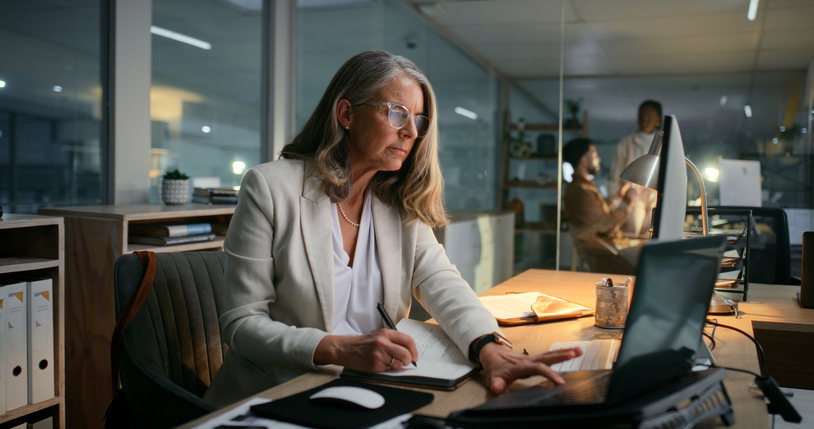 A woman deciding whether to retire early at 64 or wait until 67.