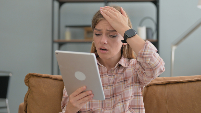 A woman thinking about the drawbacks of taking a 401(k) loan.