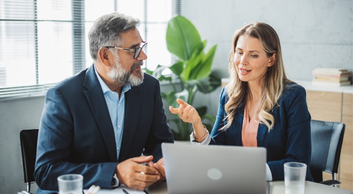 A financial advisor meeting with a client to discuss different tax credits.