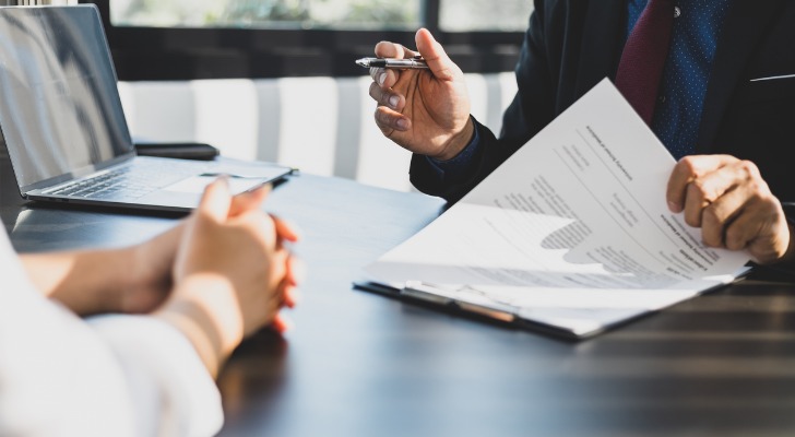 A financial advisor speaking with a client.