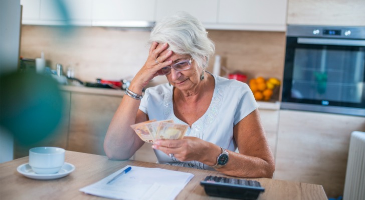 A retiree counting her money.