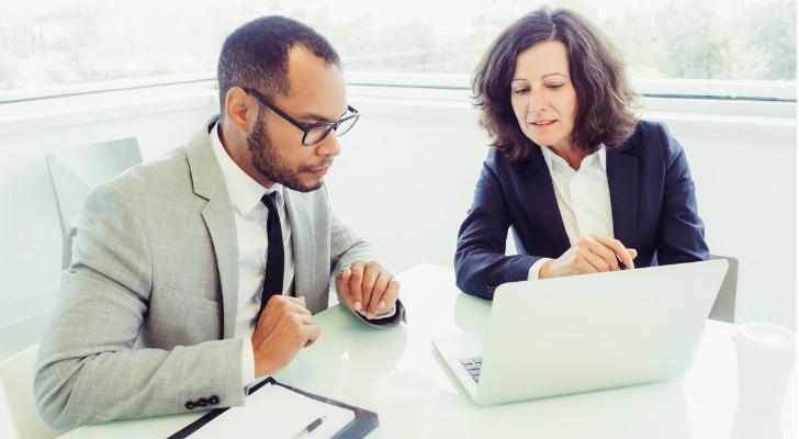 A financial advisor explaining the differences between stocks and equities.