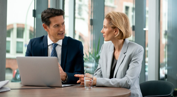 A financial advisor meeting with a client to review their investment portfolio.