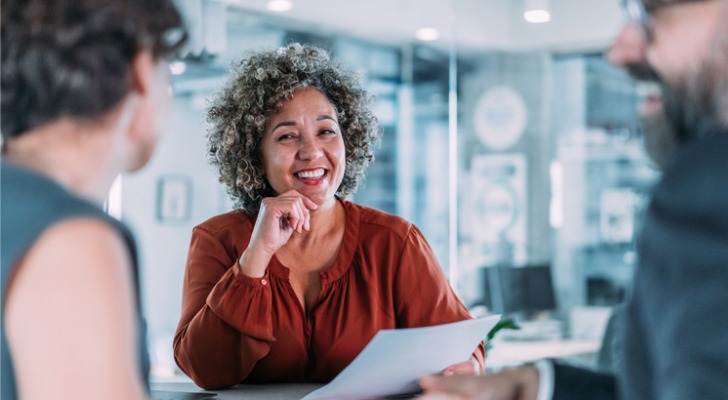 A woman reviewing nonrefundable tax credit examples.