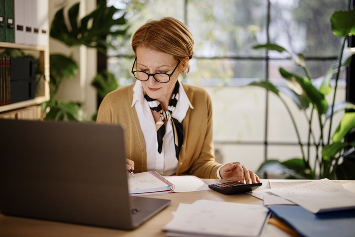 A taxpayer determining whether she should itemize deductions or file the standard deduction.