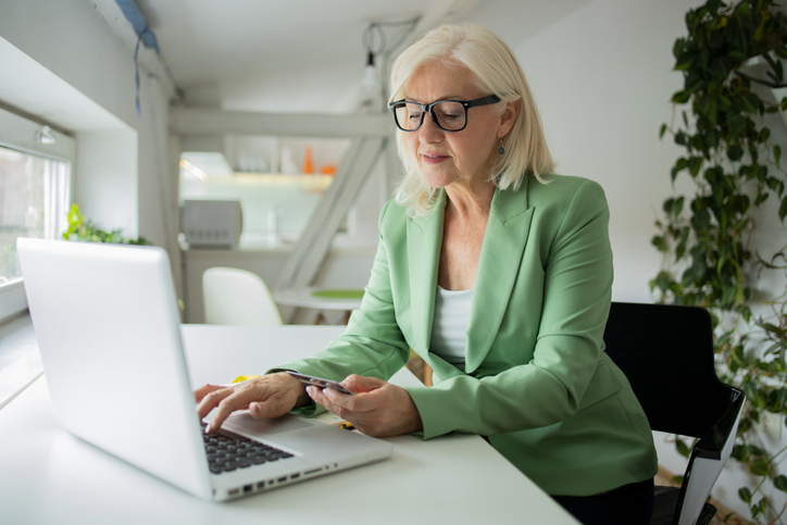 A woman looking up tax requirements for different deductions.