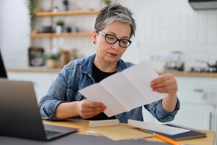 A woman creating a budget for early retirement.
