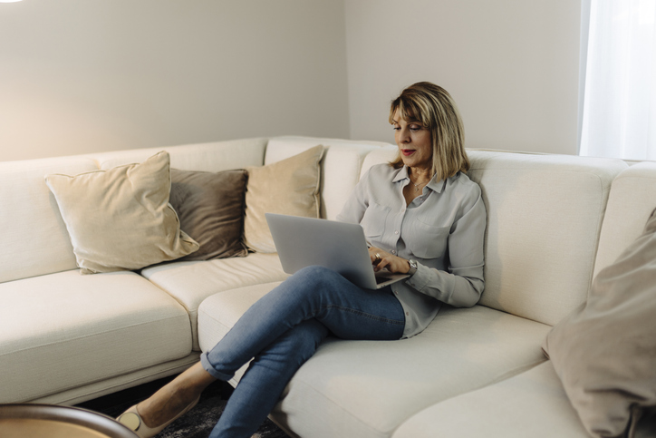 A woman using the formula to calculate net tangible assets.
