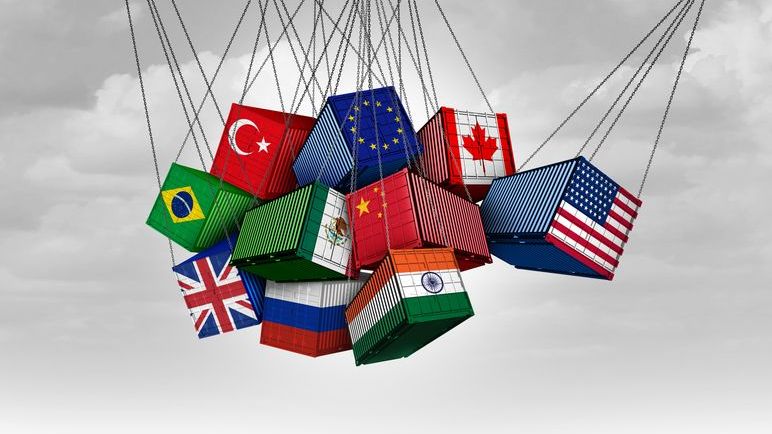 Concept art showing cargo containers decorated with various countries' flags held up by strings.