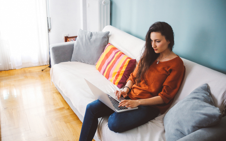 A woman reviewing her investment portfolio.