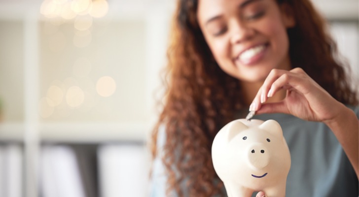 A retired couple sitting at a table reviewing their $2 million savings and planning their retirement income.