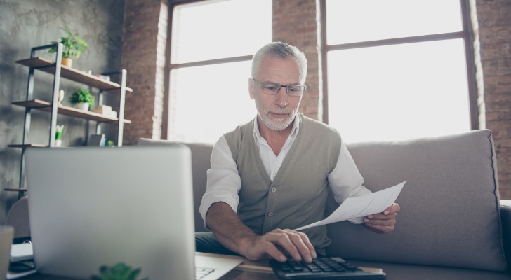 A retiree reviewing his retirement portfolio.