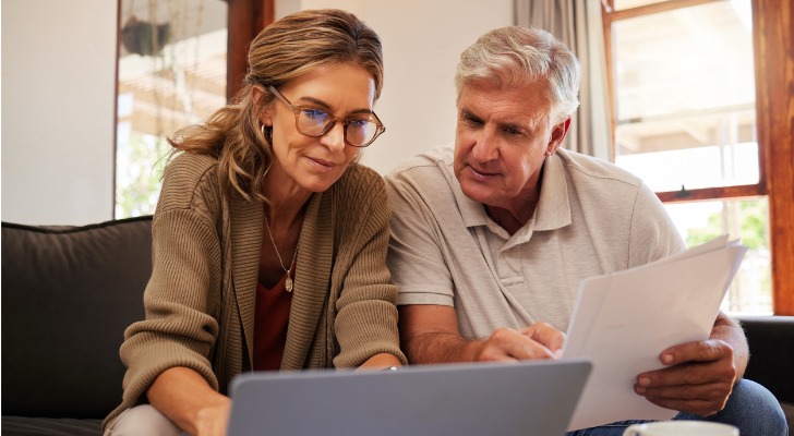 A senior couple reviewing their finances.