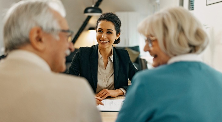 A couple meets with a female financial advisor.