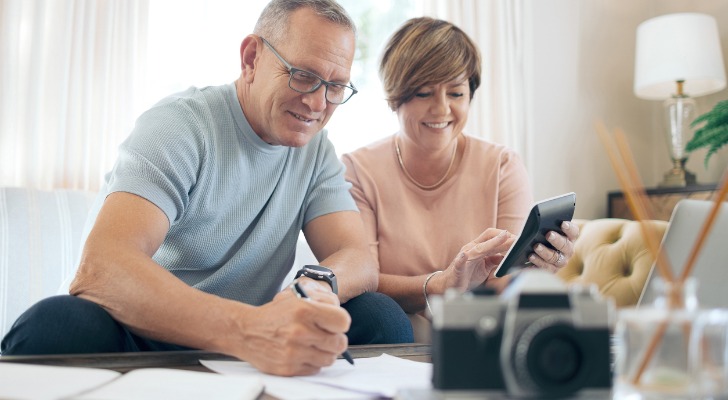 A retired couple reviewing their fixed-income investments.