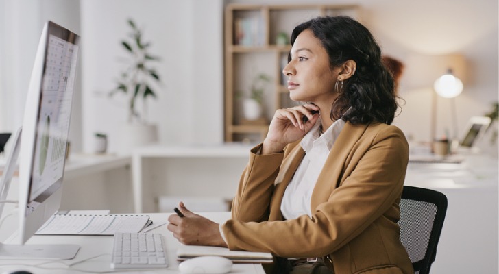 A woman looking up refundable tax credits.