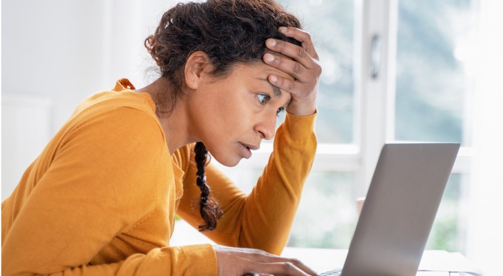 A woman looking up retirement benchmarks to compare her savings progress.