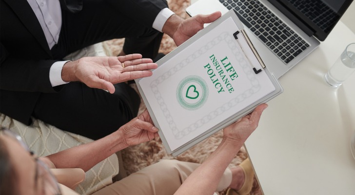 An RIA reviewing life insurance with a client.