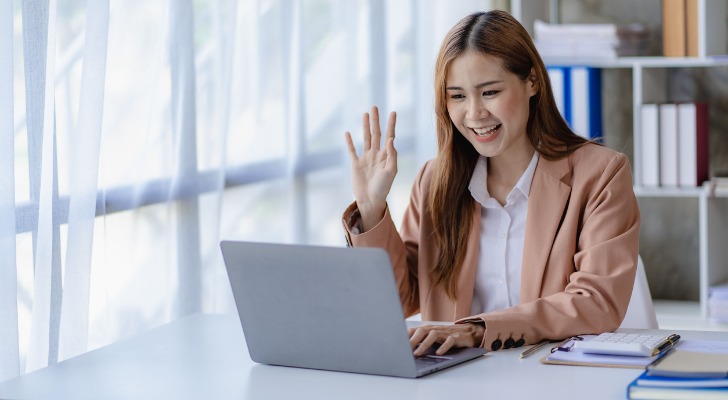 A financial advisor connecting with an estate planning client on a video call.