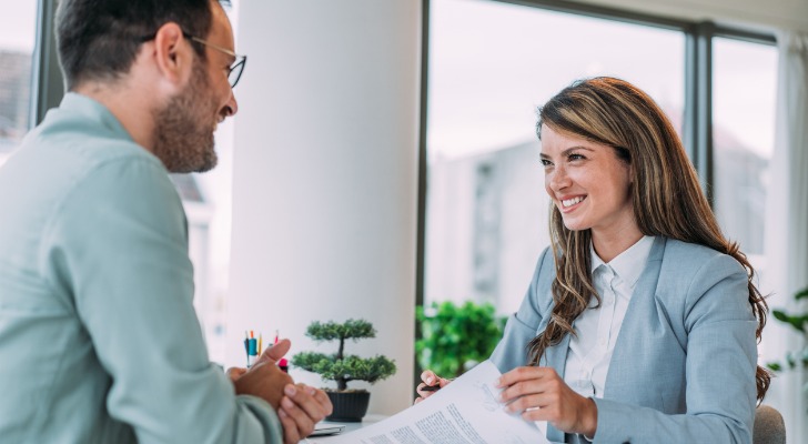 Financial advisors reviewing estate planning questions for clients.