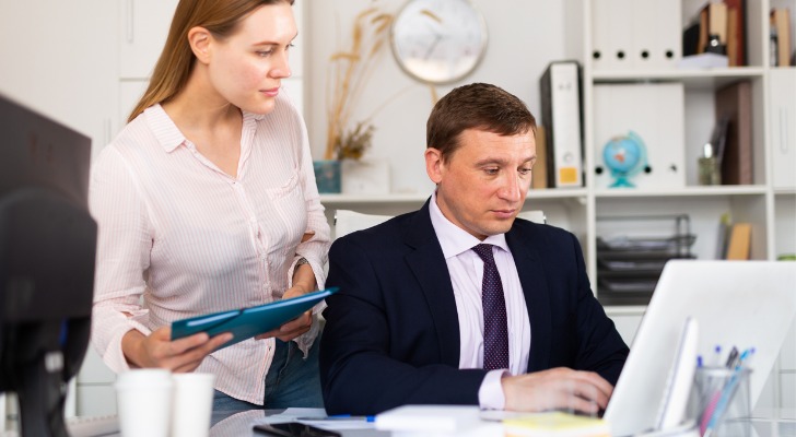 Financial advisors comparing stocks vs. bonds for a retirement portfolio.