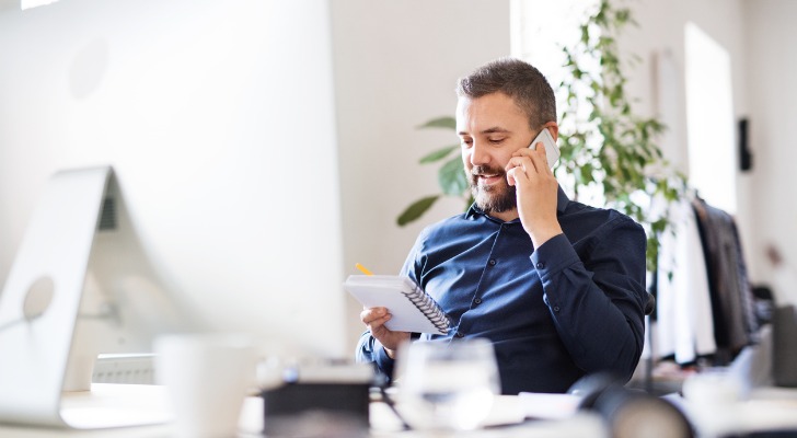 A financial advisor talking to a client about dividend investing.