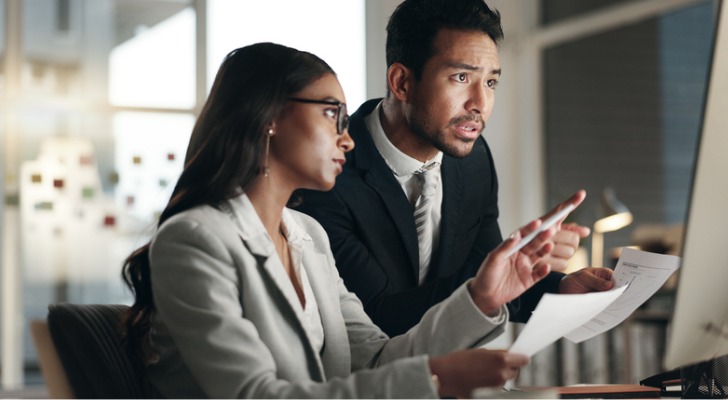 Financial advisors evaluating investment options for clients.