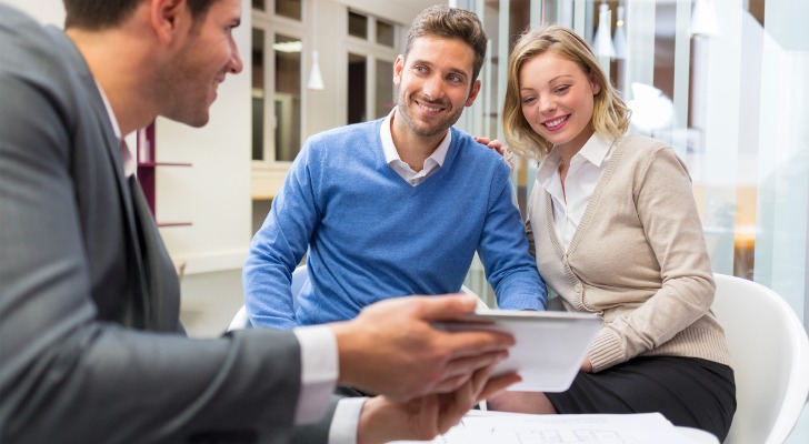 A financial advisor meeting with clients.