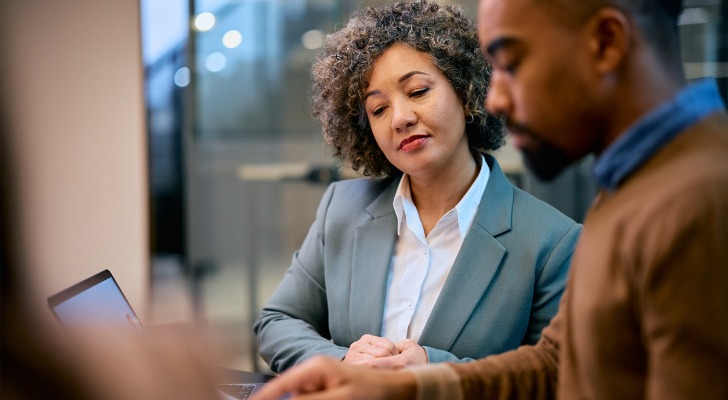 Financial advisors review a strategy for estate planning clients.