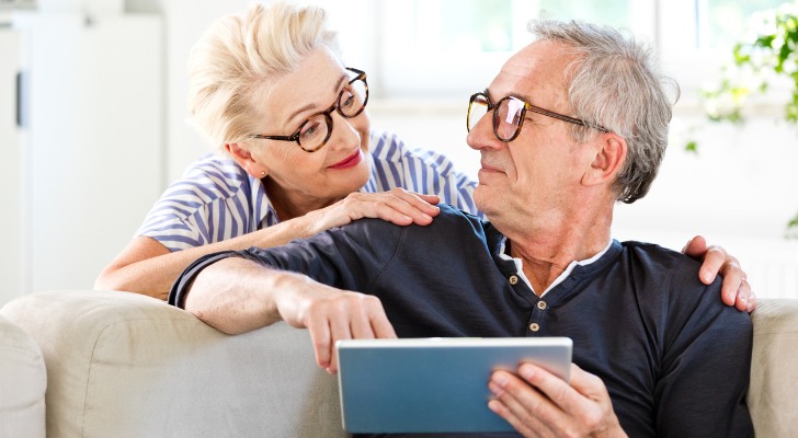 A senior couple reviewing their tax deductions.