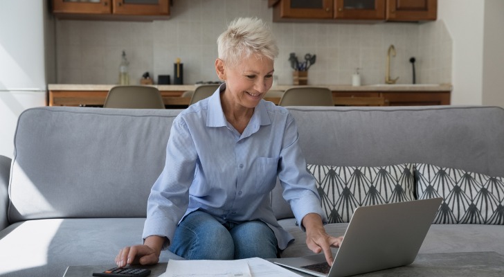 A woman evaluating reinvestment options for retirement.